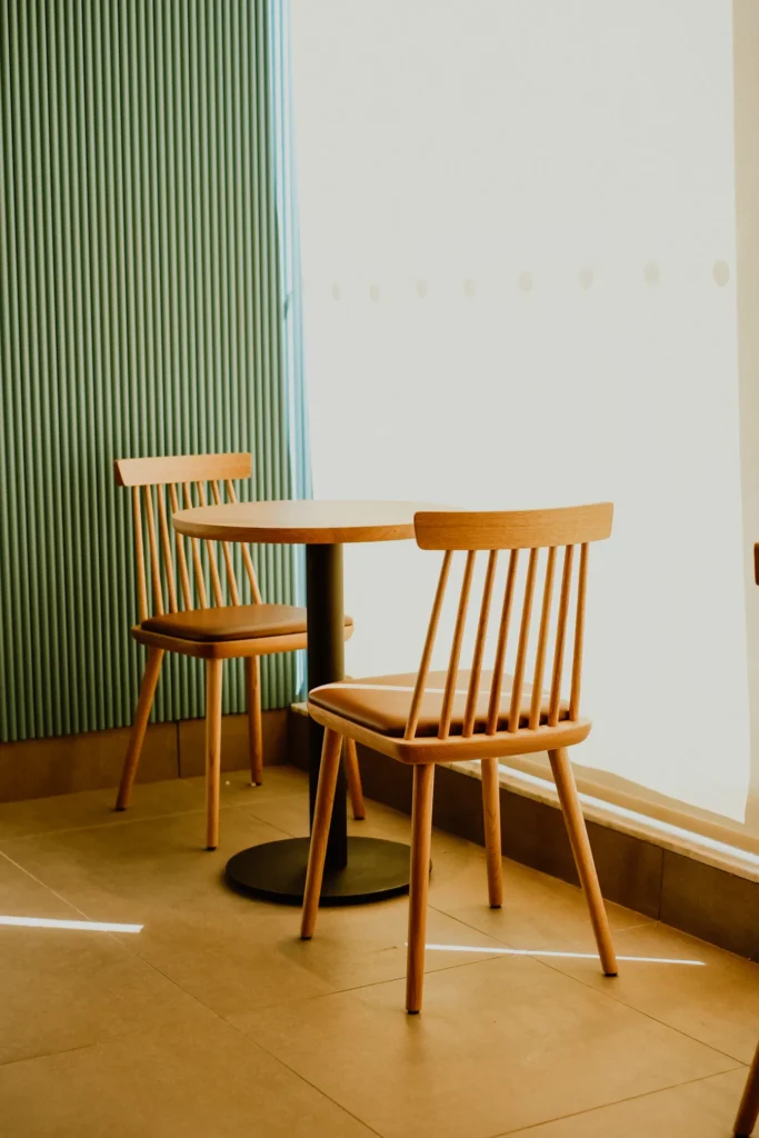 Wooden dining chairs at a round table