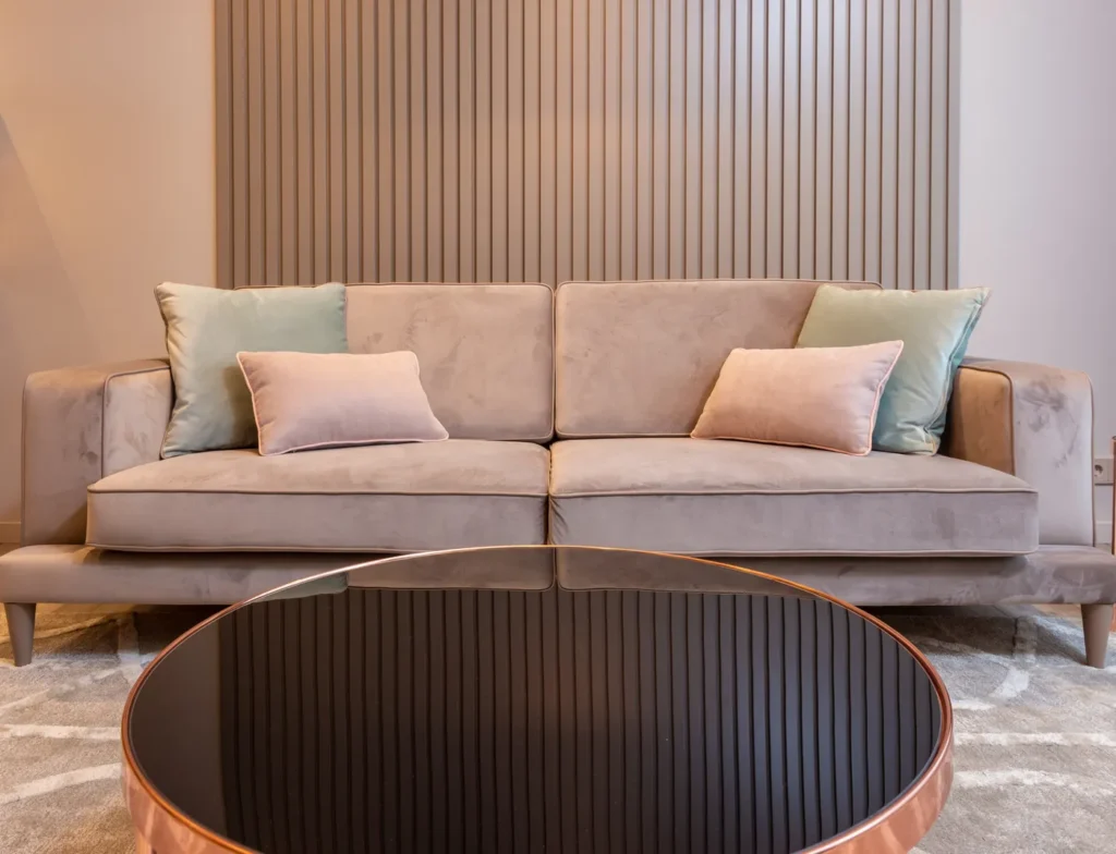 Pink sofa with cushions in a living room