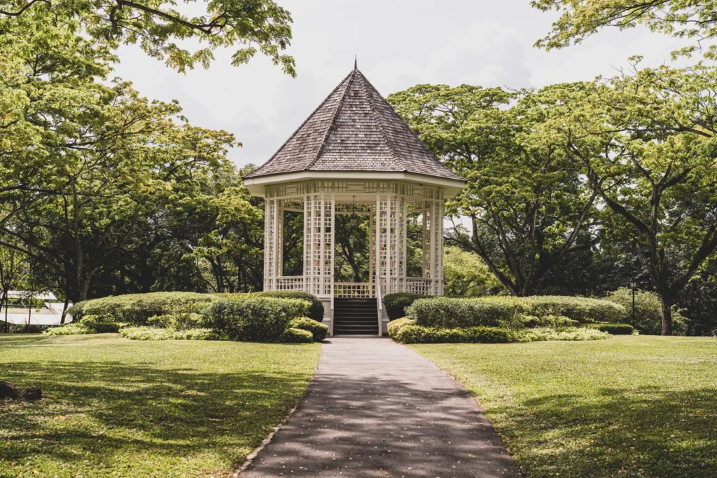 White gazebo in a landscaped garden