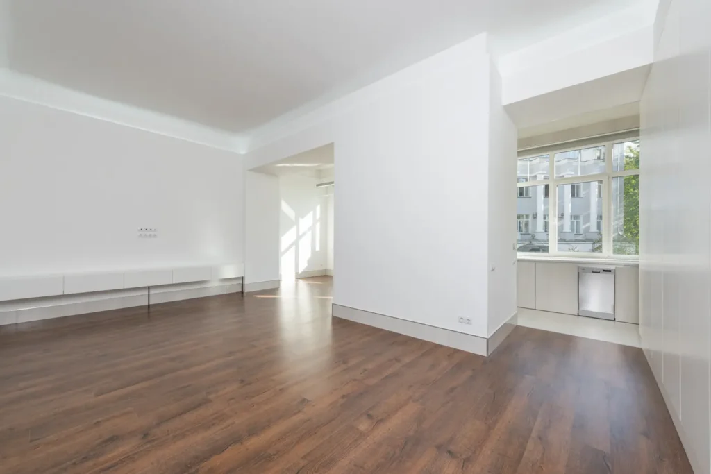 Clean empty room with wood floors