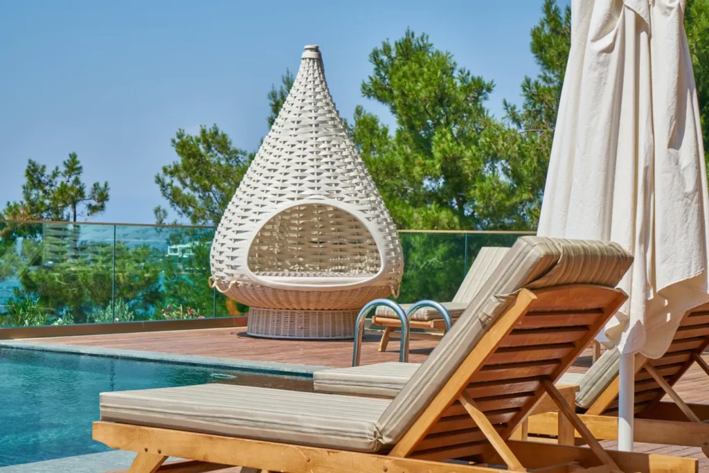 Sun loungers and an umbrella on a pool deck