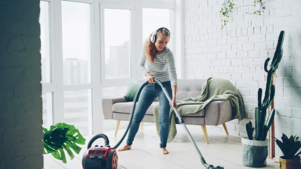 Woman vacuuming a living room