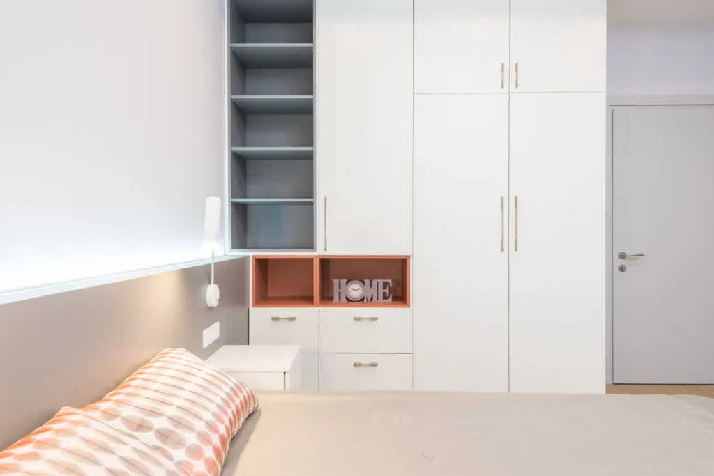 White fitted wardrobe in a bright bedroom